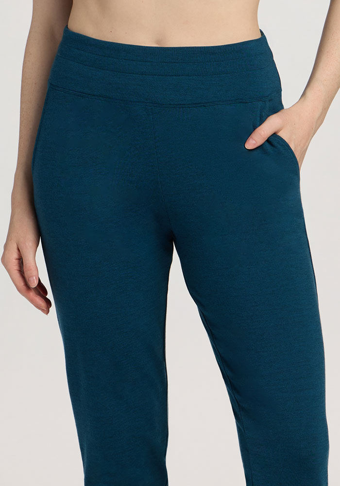 Model wears Woolx Madden Petite Joggers in Majolica Blue, hand in pocket, shown waist to mid-thigh.