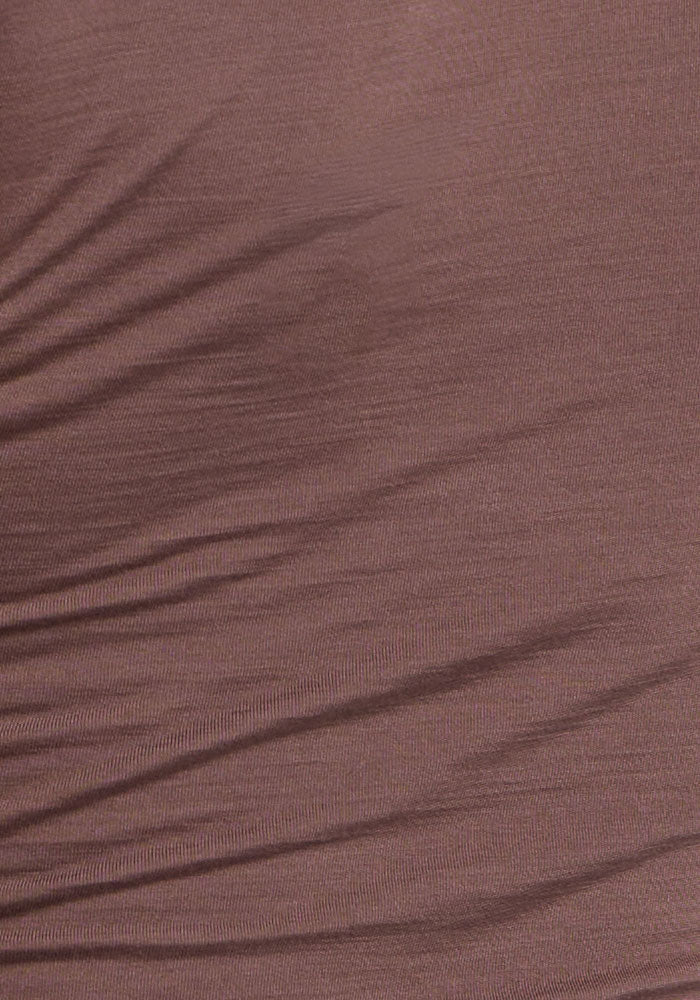 Close-up of wrinkled brown fabric, resembling the soft folds of the Woolx Maggie Bodysuit - Peppercorn.
