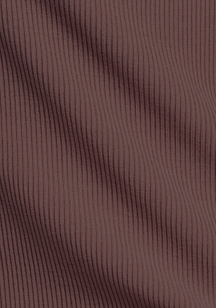 Close-up of Woolx Maisey Ribbed Shorts in Peppercorn, featuring stretchy merino wool with vertical ribbed texture.