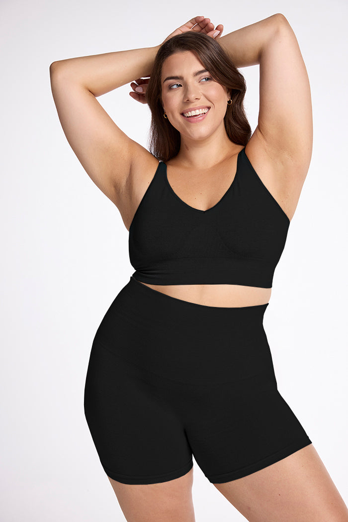 Model wearing Marley shapewear shorts in black with arms over head | Juliana is 5'10", wearing a size XL