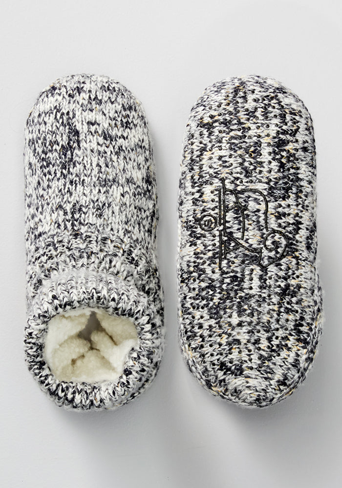 The Woolx Men's Gripper Slipper Bootie in Speckled Stone features soft Sherpa lining and a decorative knit pattern, with an embroidered sole design for added style and comfort.