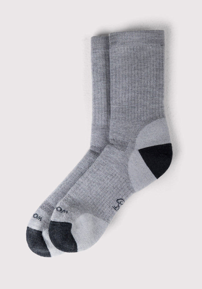 A pair of Woolx Mens Core Crew Socks - Grey, with darker heels and toes and arch support, are neatly overlapped on a plain white background.