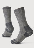 The Woolx Extreme Full Cushion Crew Socks in Charcoal Heather feature thick Merino wool with darker accents on the heel, toe, and sole for superior warmth and comfort, shown against a plain white background.