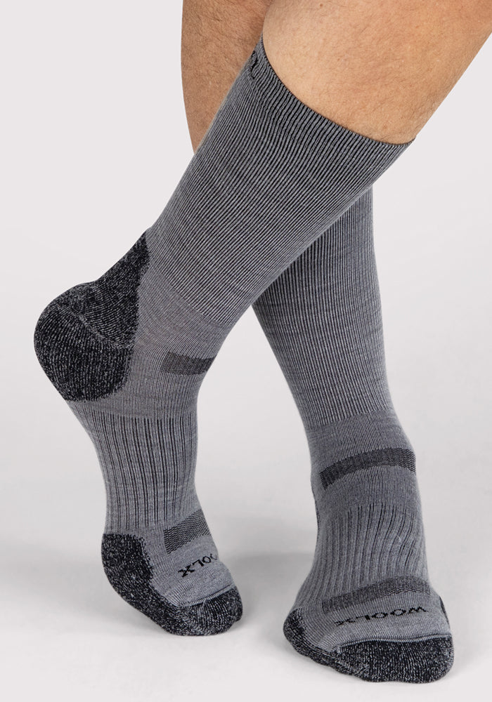 A pair of grey Woolx Mens Harbor Crew Socks featuring moisture-wicking Merino wool.