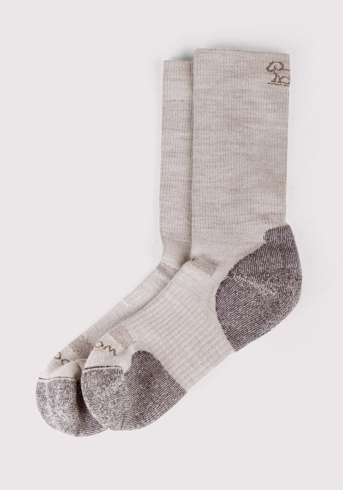 The Woolx Mens Harbor Crew Sock - Icicle is a light gray, breathable sock with darker gray reinforced heels and toes, shown flat on a white background and featuring a small logo near the top cuff.