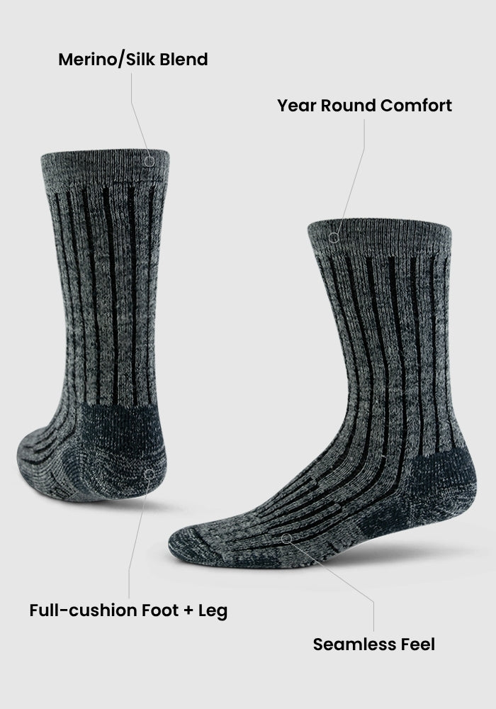 Two Stone Grey Woolx Joey Crew Socks stand upright, showcasing "Merino Wool/Silk Blend," "Year Round Comfort," "Full-cushion Foot & Leg," and a seamless feel. They appear thick, soft, and ribbed.