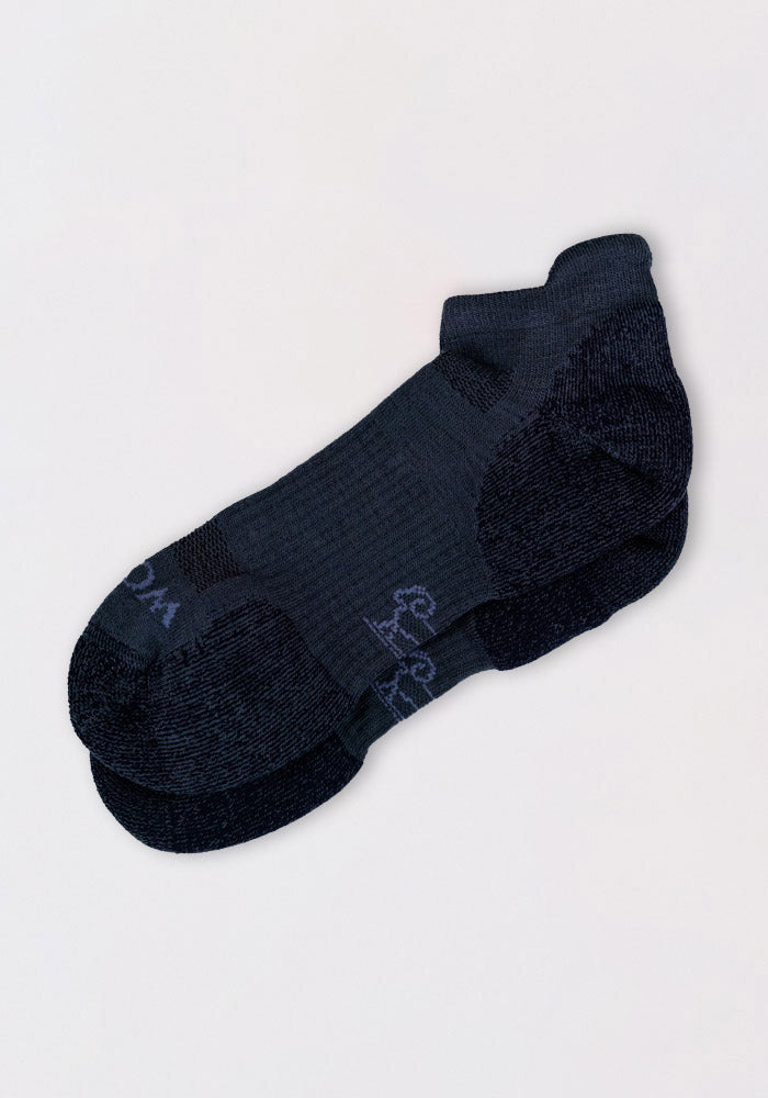 A pair of Mens Rowan No Show Socks in Evening Tide by Woolx, featuring cushioned support and reinforced heels and toes, is neatly stacked on a plain white background.