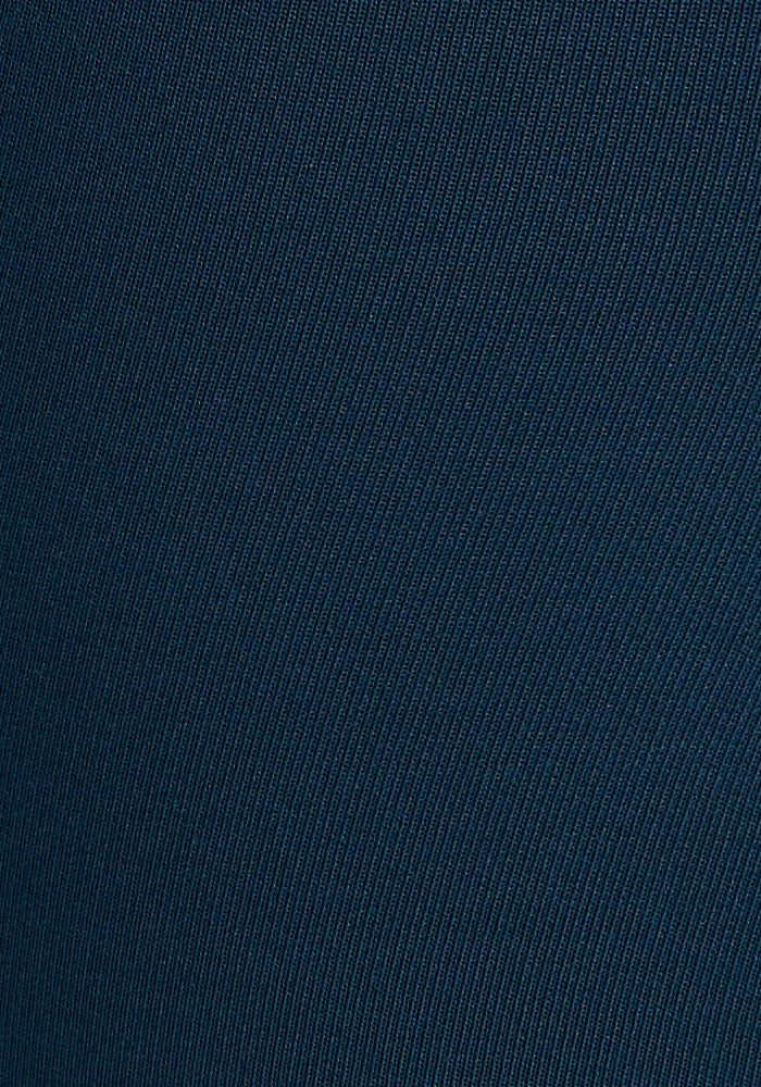 Close-up of Woolx Merino Flex® McKenna Petite leggings in Majolica Blue, featuring handy pockets and a subtle diagonal ribbed texture with fine, evenly spaced lines.