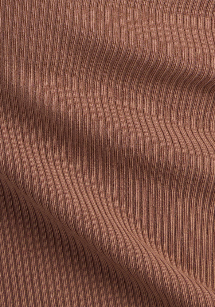 Close-up of Woolx Miley Bike Shorts • Final Sale - Sienna Kiss, showing brown ribbed fabric with a wavy texture.