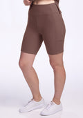 Person wearing Woolx Miley Bike Shorts in Peppercorn and white sneakers, standing against a plain white background. | Ariana is 5'11", wearing a size S