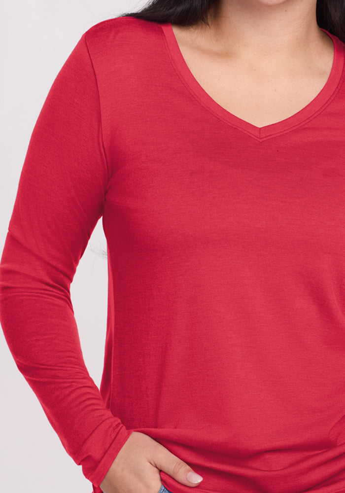 Person wearing the Woolx Millie Long Sleeve in Berry Ice Pop with one hand on their hip, shown waist-up.