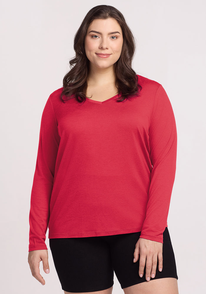 Woman with long dark hair wears the Woolx Millie Long Sleeve - Berry Ice Pop and black shorts, against a light background. | Juliana is 5'10", wearing a size XL