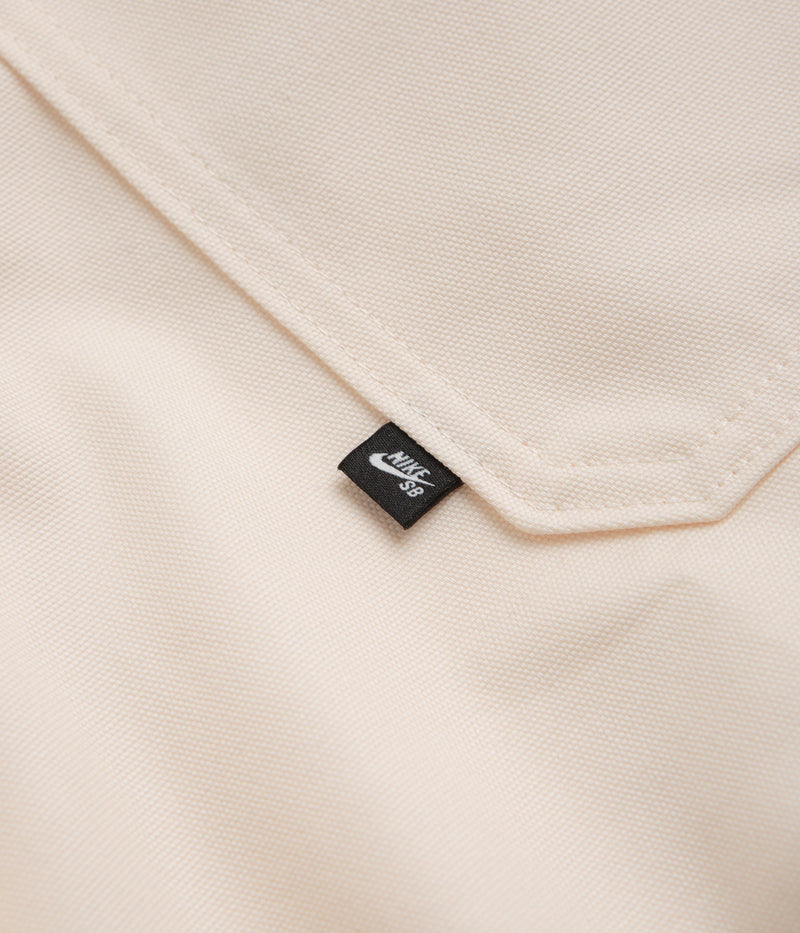 Nike SB New Essential Woven Shirt in Guava Ice and Neutral Olive