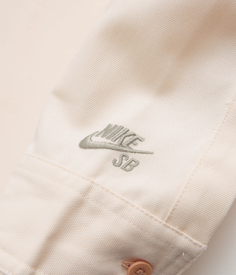 Nike SB New Essential Woven Shirt in Guava Ice and Neutral Olive