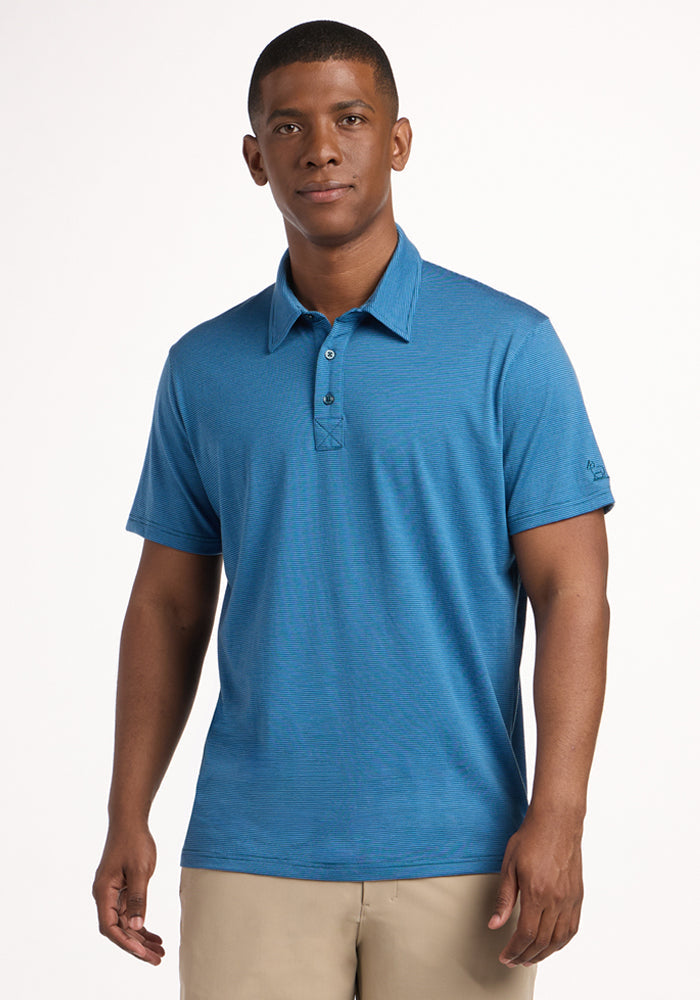 A man wearing a Woolx Preston Polo - Coastal Mini Stripe and khaki pants stands facing the camera against a plain white background.