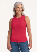 Smiling older woman in the Woolx Raegan Ribbed Tank Top - Berry Ice Pop and blue jeans, against a plain background. | Tam is 5’8.5”, wearing a size S