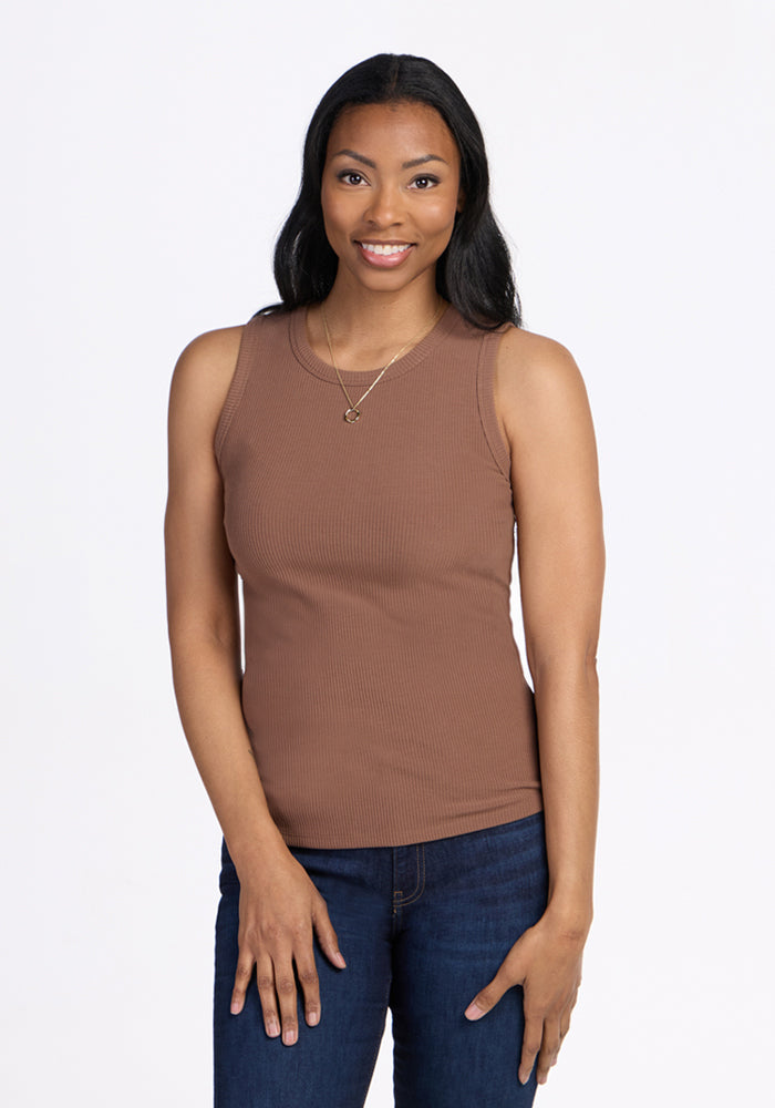 Woman with long dark hair wears Woolx Raegan Ribbed Tank Top in Sienna Kiss, smiling at camera against white background.