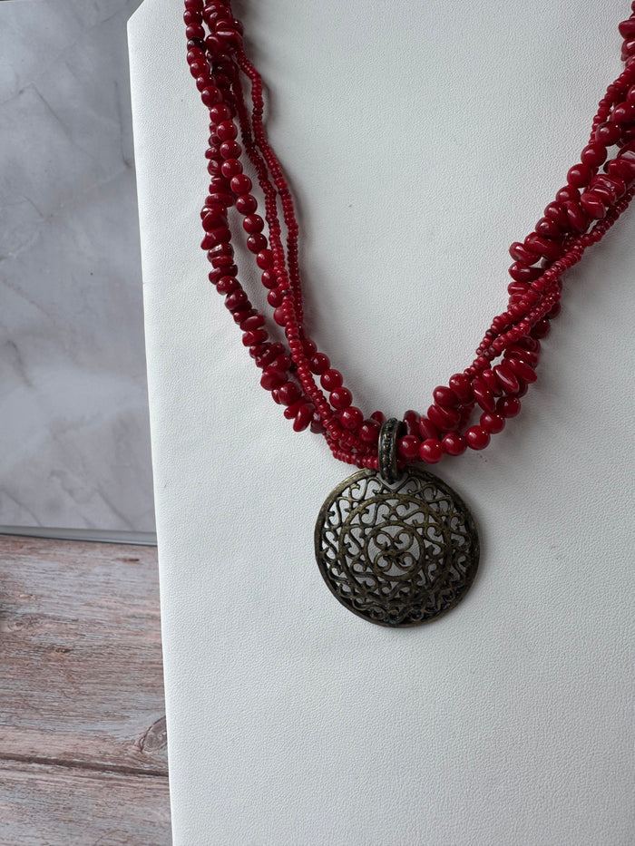 Red Beaded Torsade Necklace with Bronze Tone Filigree Pendant