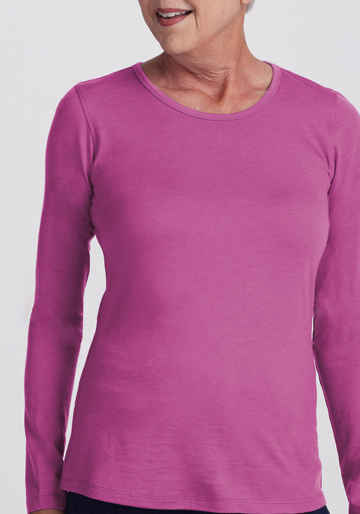Smiling older woman in Woolx Remi Long Sleeve T-Shirt in Purple Wine, shown from shoulders to hips. Final Sale.