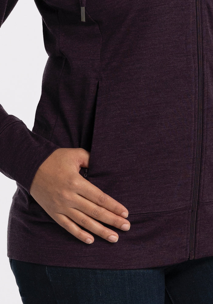 Someone in the Woolx Ryann Hoodie • Final Sale - Deep Plum, left hand resting on a side pocket.