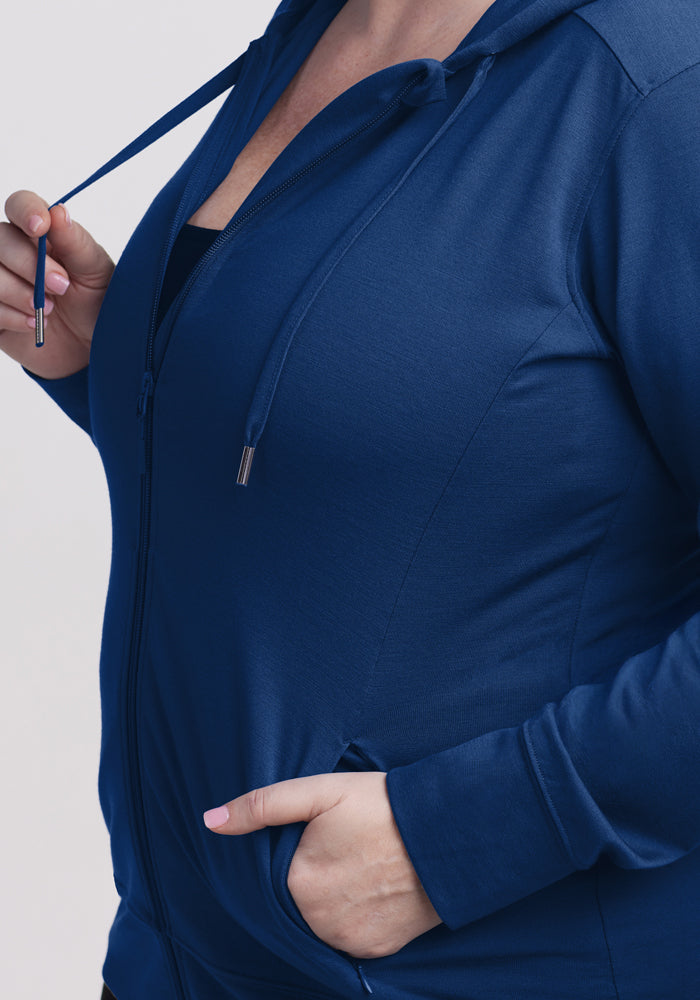 Wearing the Woolx Ryann Hoodie • Final Sale - Estate Blue, holding a drawstring and with a hand in the front pocket.