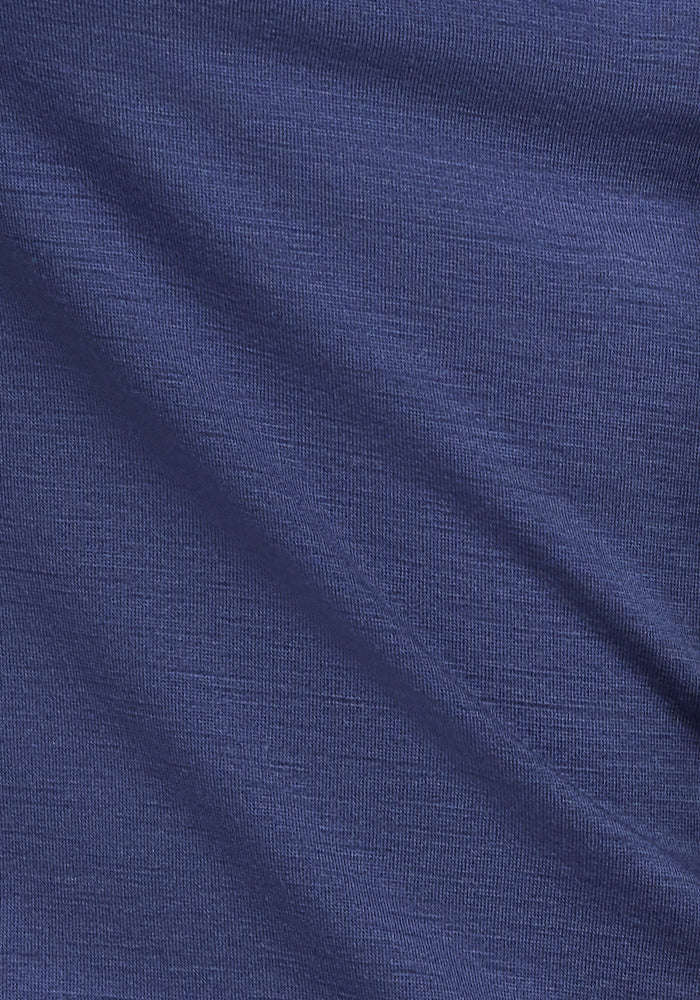 Close-up of textured dark blue fabric likely from Woolx's Sophia Bodysuit - Blue Horizon. It shows the weave pattern and slight creases, appearing soft and slightly shiny, perfect for a smooth finish.