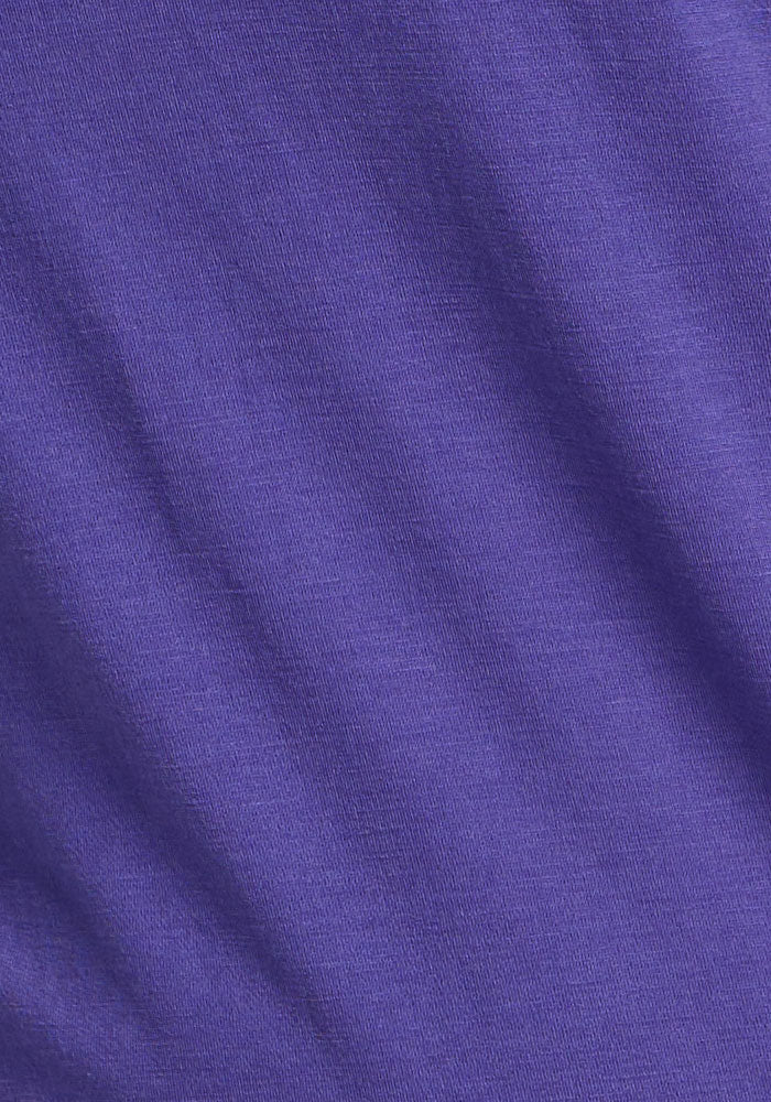 Close-up of Summit Polo - Berry Indigo by Woolx, with ribbed texture—perfect for athletic wear and moisture control.