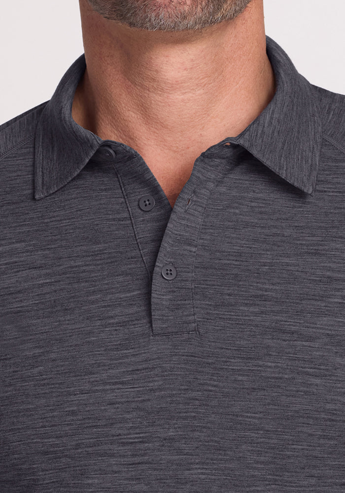 Close-up of a man in the Woolx Summit Polo • Final Sale - Cinder Melange, two buttons undone.