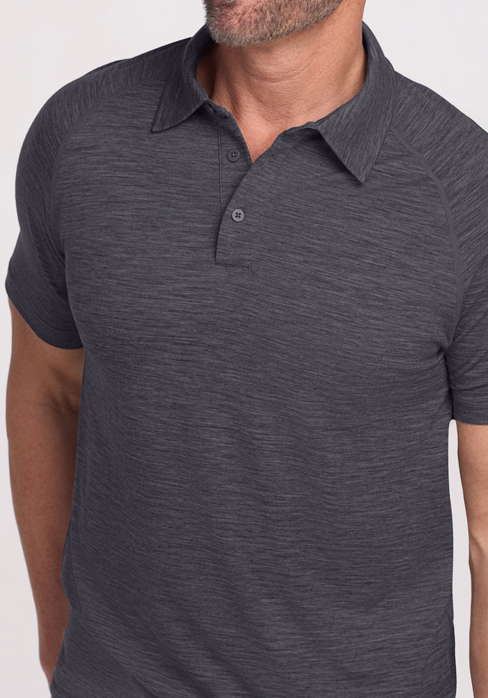 Man wearing a Woolx Summit Polo in Cinder Melange, shown from shoulders to mid-torso. Final Sale.