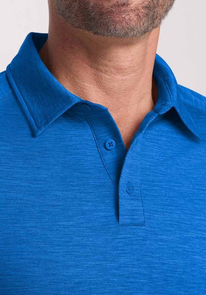 Close-up of a man wearing the Woolx Summit Polo in Glacial Blue, showing his neck and part of his face.