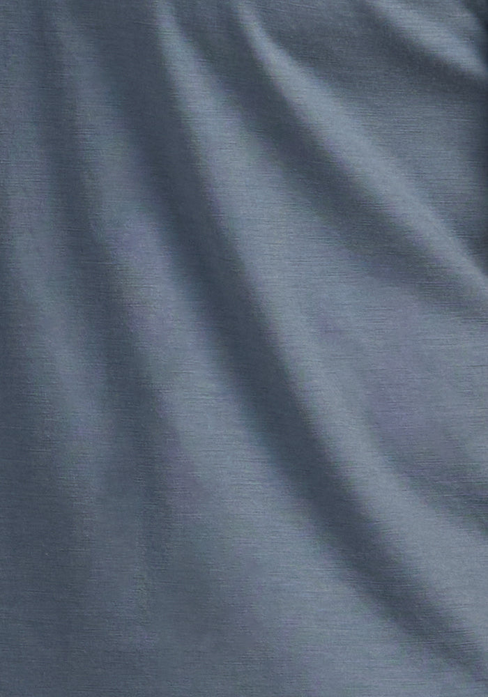 Woolx Summit Polo • Final Sale - Stormy Weather features blue-gray Merino wool with soft folds and a textured surface.
