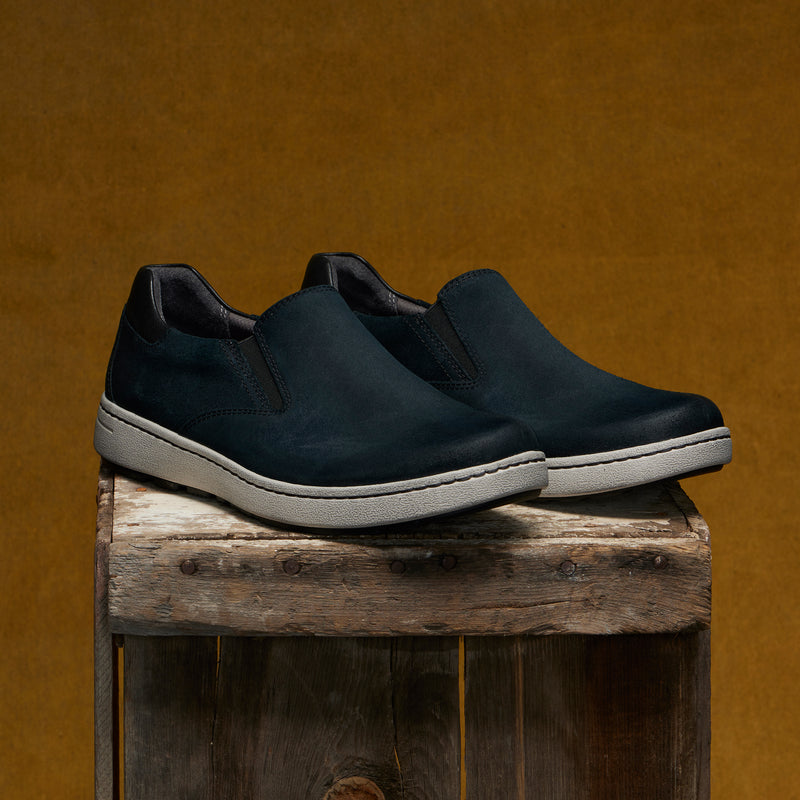 Men's slip-on sneakers in soft black leathers with a casual outsole.
