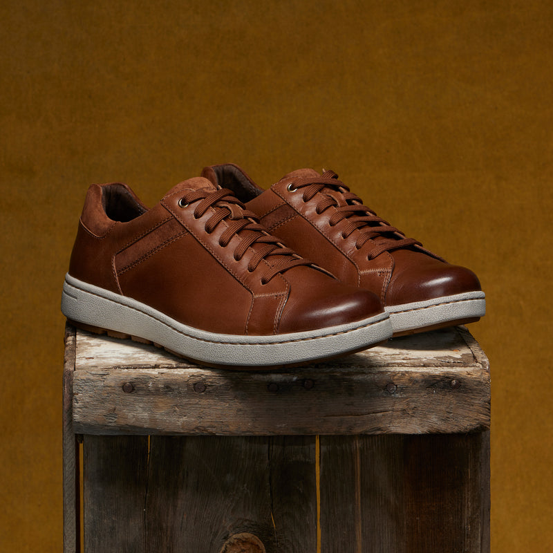 Men's slip-on sneakers in soft brown leathers with a casual outsole.