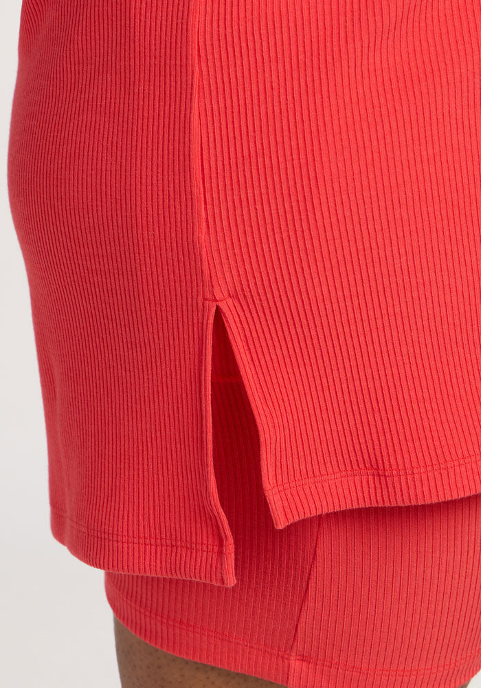 Close-up of Woolx Vera Ribbed Tunic in Hibiscus, featuring a side slit on the tunic-length top.