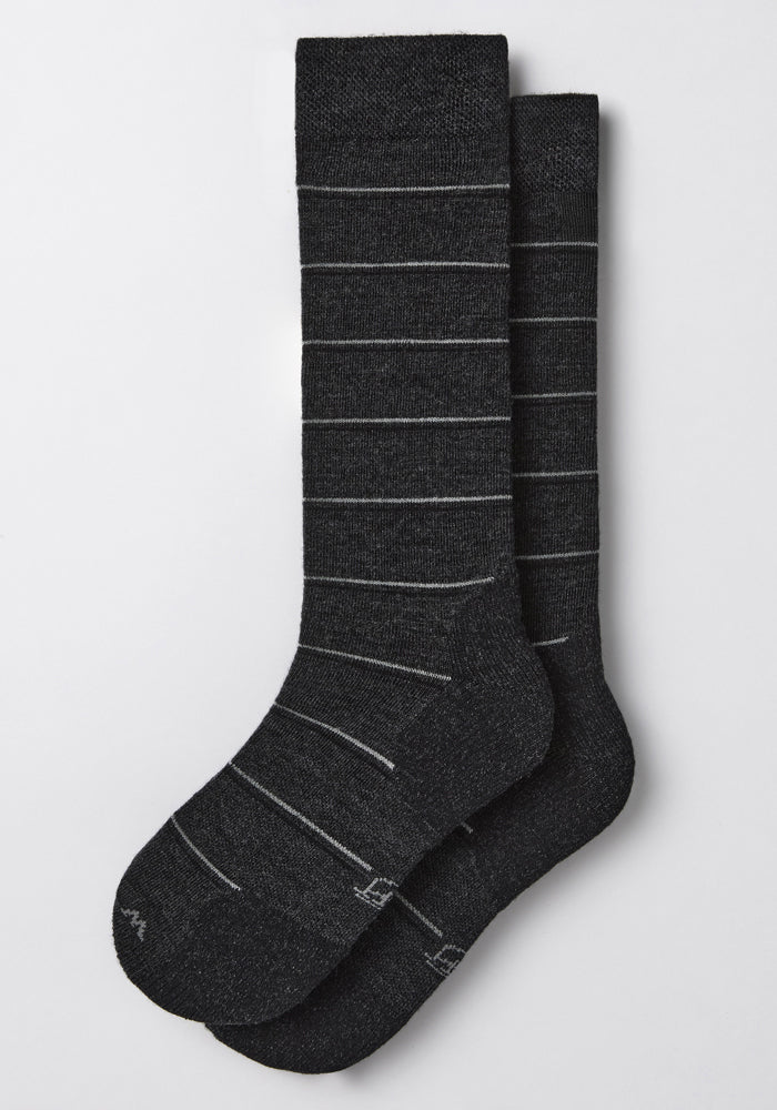 A pair of Woolx Womens Chandler Mid Calf Socks in dark grey charcoal, featuring a Merino wool blend and light gray stripes, laid flat on a light background.