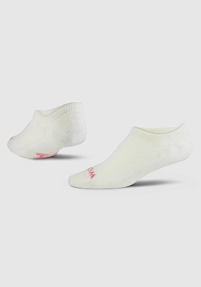 A pair of Woolx Womens Daisy Promotional Ped Socks in Sweet Peony, featuring a white low-cut design and a small pink logo near the toe, displayed on a plain light gray background.