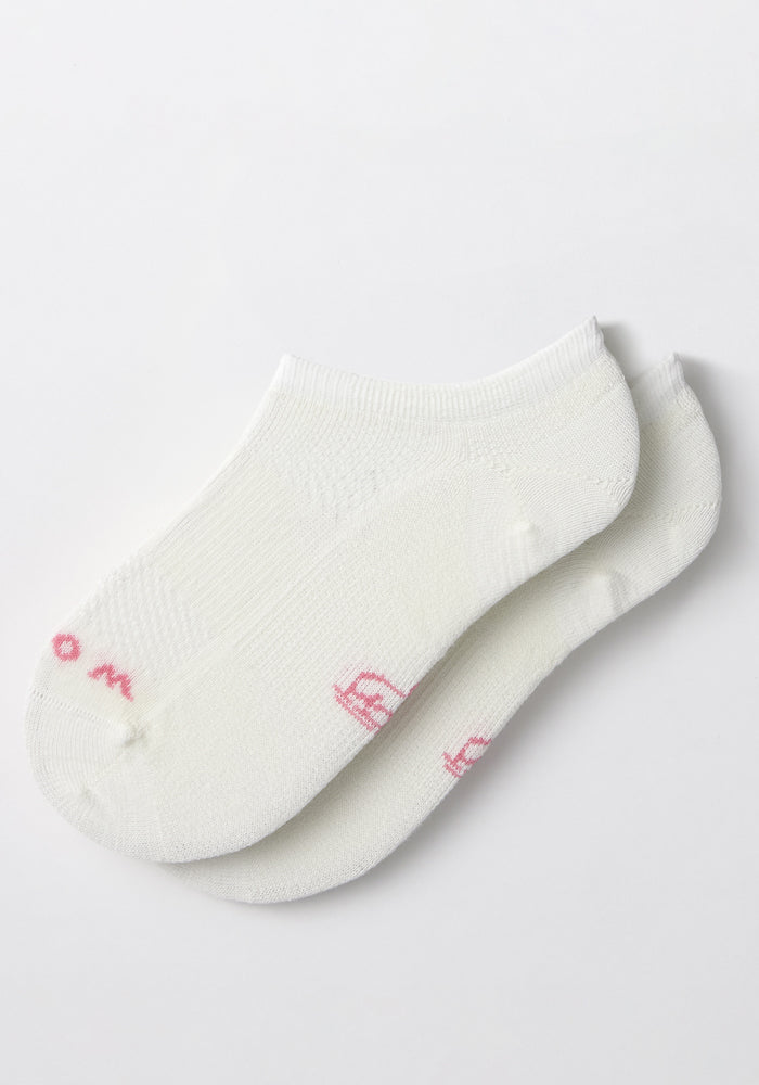 Two Woolx Womens Daisy Ped Socks in White Lightning, featuring pink writing near the toes, are laid on top of each other against a plain white background.