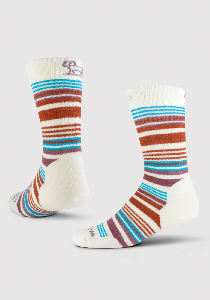 A pair of Woolx's Everyday Light Cushion Crew Socks - Natural Stripe, featuring odor-resistant properties and horizontal stripes in brown, blue, and turquoise. Made from temperature-regulating Merino wool, these socks are showcased against a light gray background to emphasize their vibrant design.