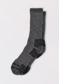 A pair of Woolx Womens Extreme Crew Socks in Charcoal Heather, featuring heavyweight merino wool and reinforced heels and toes—perfect for staying warm in cold weather.