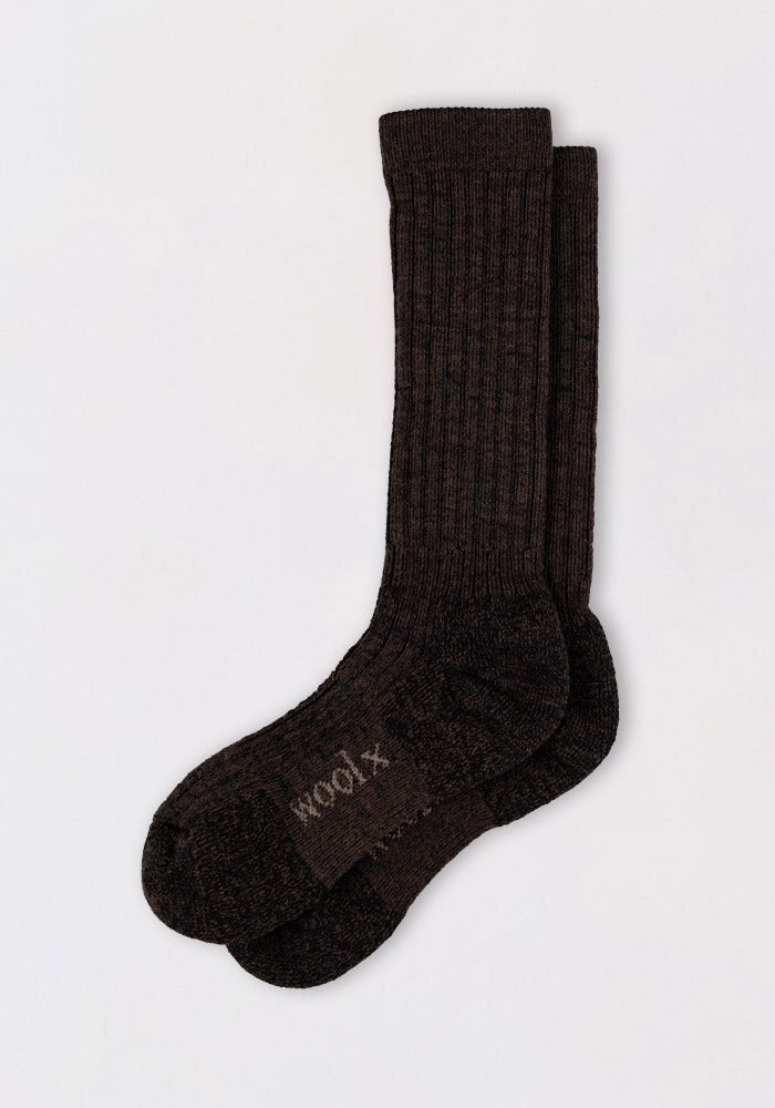 A pair of Woolx Womens Joey Mid Calf Socks in Dark Espresso, featuring ribbed merino wool and "MOON" in light letters on the sole, displayed flat on a plain white background.