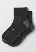 The Woolx Womens Rambler Ankle Sock - Black Pepper features black ankle socks with gray accents, a textured knit pattern, white side text, and superior moisture management for lasting comfort.