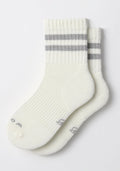 The Womens Varsity Mini Crew Socks by Woolx in Polar White feature two gray stripes near the top, subtle gray toe lettering, and a moisture-wicking design to keep feet dry and comfortable.